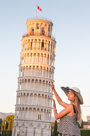 Girl Posing with the  Leaning Tower of Pisa, Italy